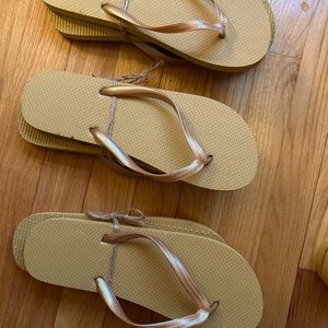 Rubber flip flops in a rich golden tannish color